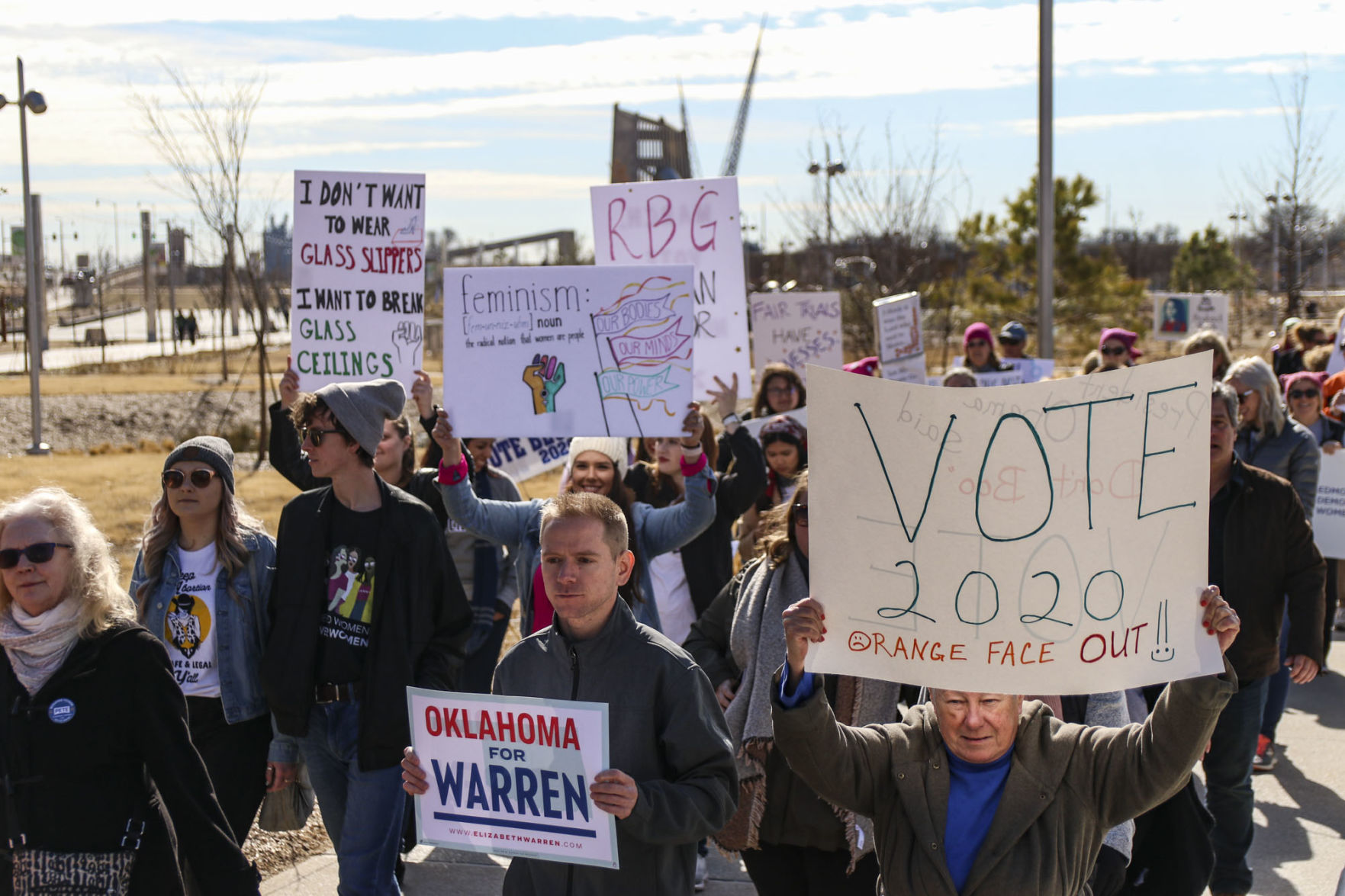 Participants march with signs